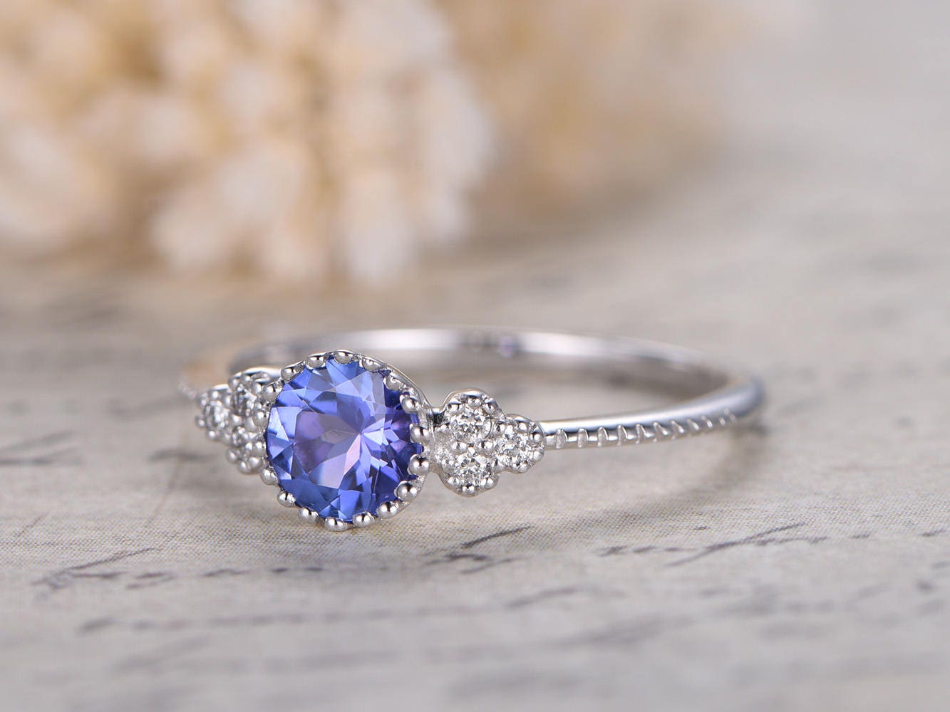 5mm-round-tanzanite-engagement-ring-14k-white-gold-three-stone-diamond-band-deco-floral-design
