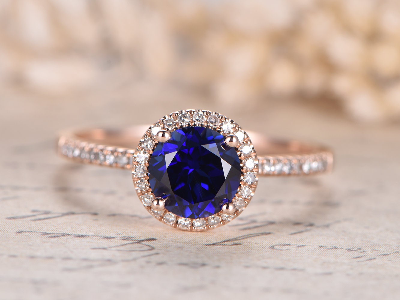 7mm-round-cut-sapphire-engagement-ring-14k-rose-gold-diamond-halo-design