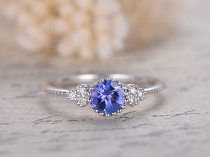 5mm-round-tanzanite-engagement-ring-14k-white-gold-three-stone-diamond-band-deco-floral-design