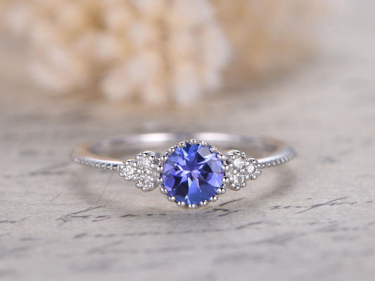 5mm-round-tanzanite-engagement-ring-14k-white-gold-three-stone-diamond-band-deco-floral-design