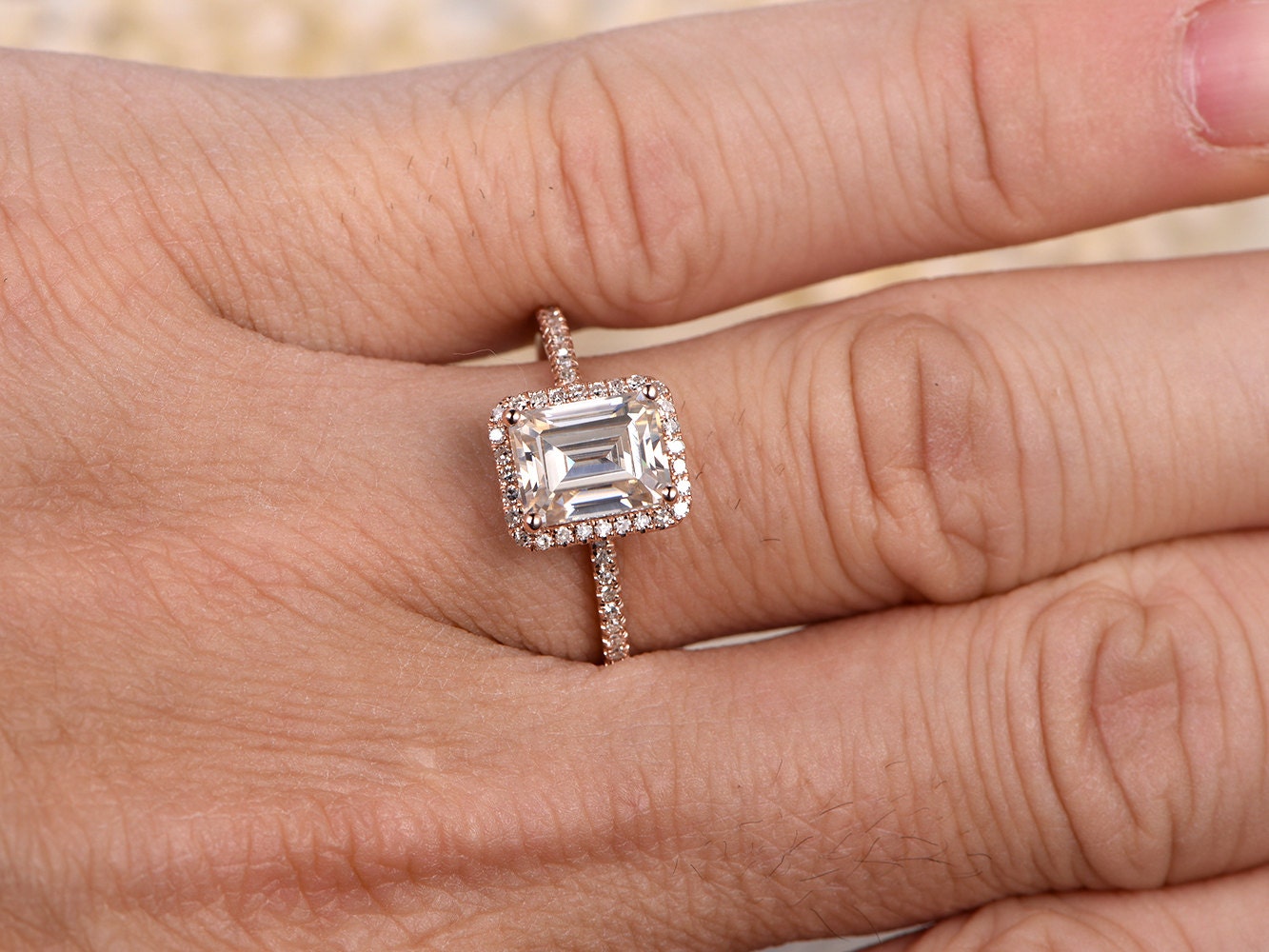 6x8mm-emerald-cut-moissanite-engagement-ring-14k-rose-gold-diamond-halo-design-half-eternity-band