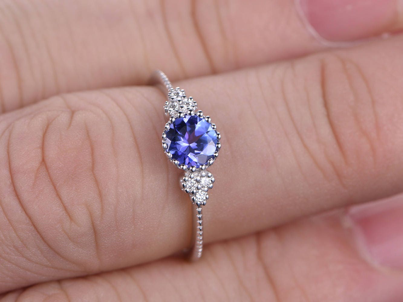 5mm-round-tanzanite-engagement-ring-14k-white-gold-three-stone-diamond-band-deco-floral-design