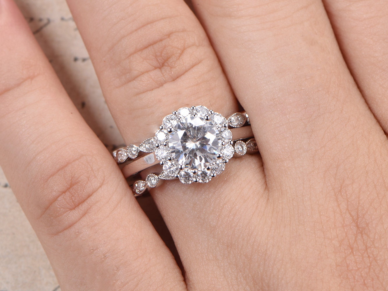 7mm-round-cut-moissanite-engagement-ring-set-3pcs-14k-white-gold-floral-halo-two-art-deco-band