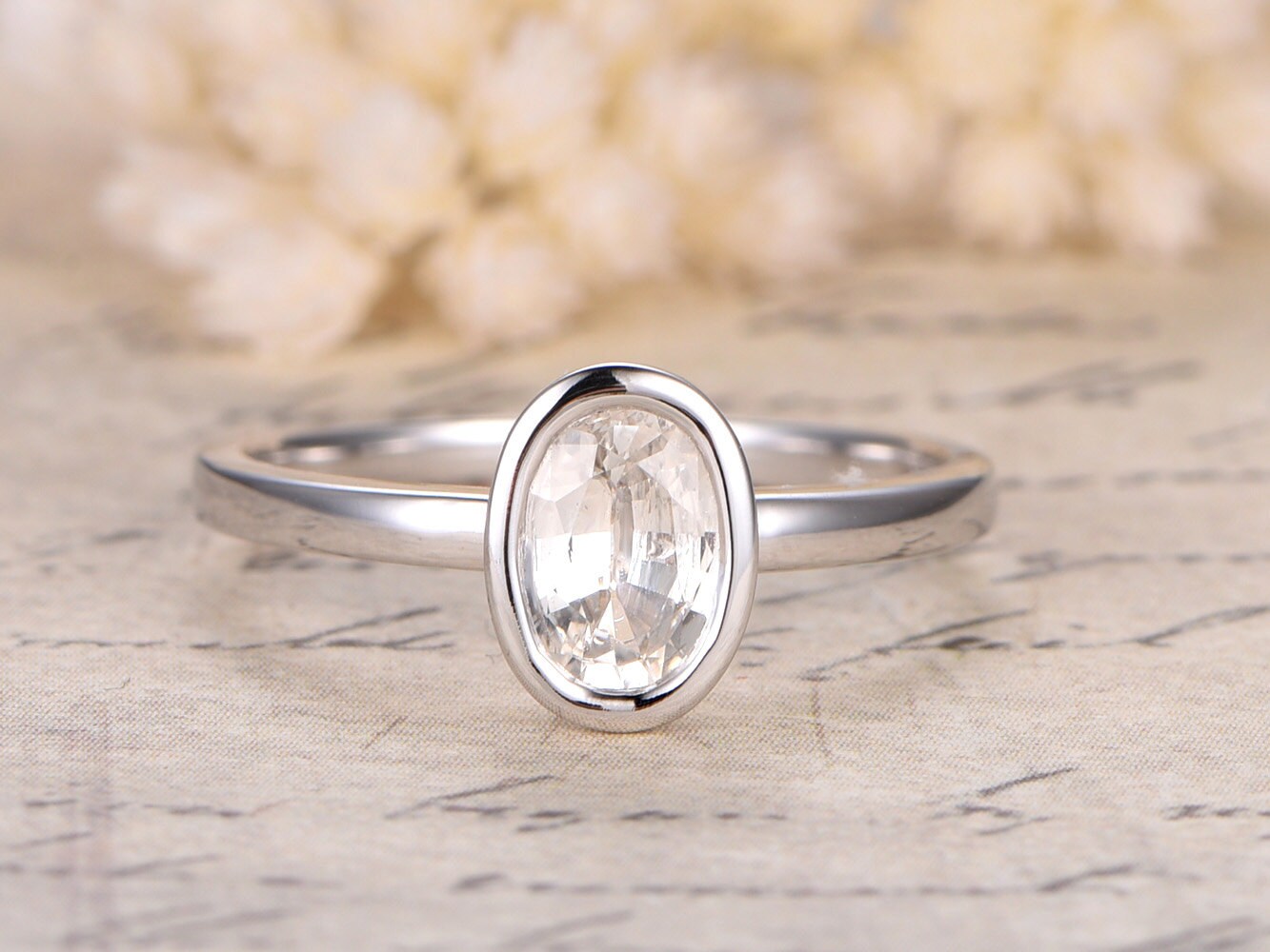 5x7mm-oval-cut-white-sapphire-engagement-ring-14k-white-gold-bezel-set-plain-band