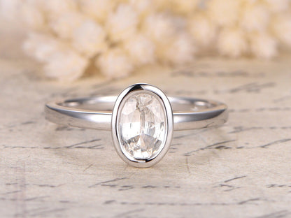 5x7mm-oval-cut-white-sapphire-engagement-ring-14k-white-gold-bezel-set-plain-band