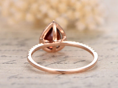 5x7mm-pear-cut-red-garnet-engagement-ring-14k-rose-gold-diamond-halo-half-eternity