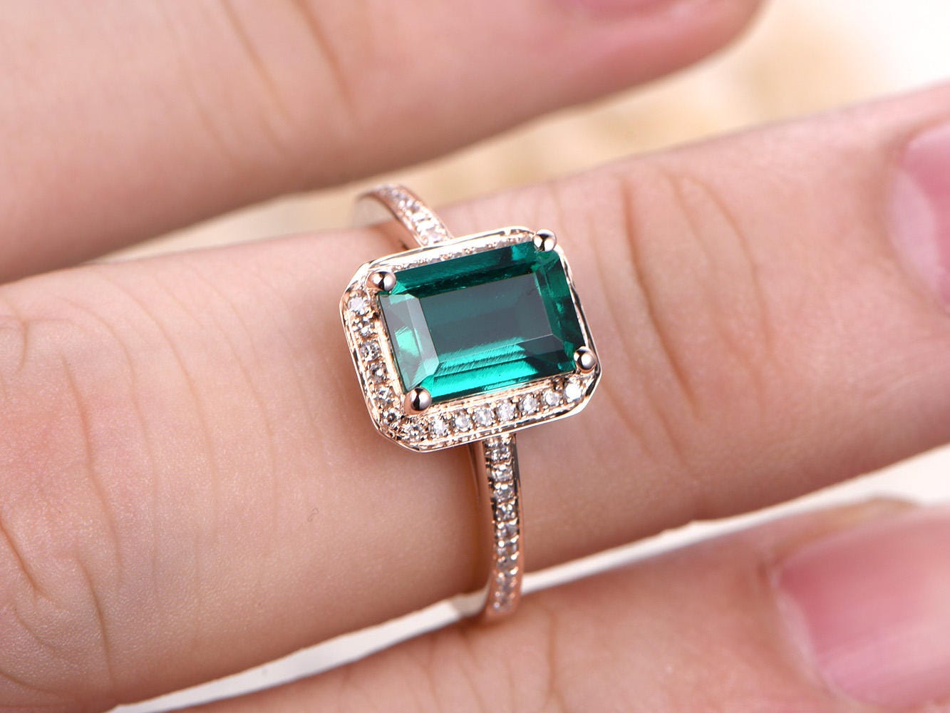 6x8mm-emerald-cut-emerald-engagement-ring-14k-rose-gold-may-birthstone-diamond-halo-half-eternity-band