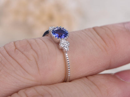 5mm-round-tanzanite-engagement-ring-14k-white-gold-three-stone-diamond-band-deco-floral-design